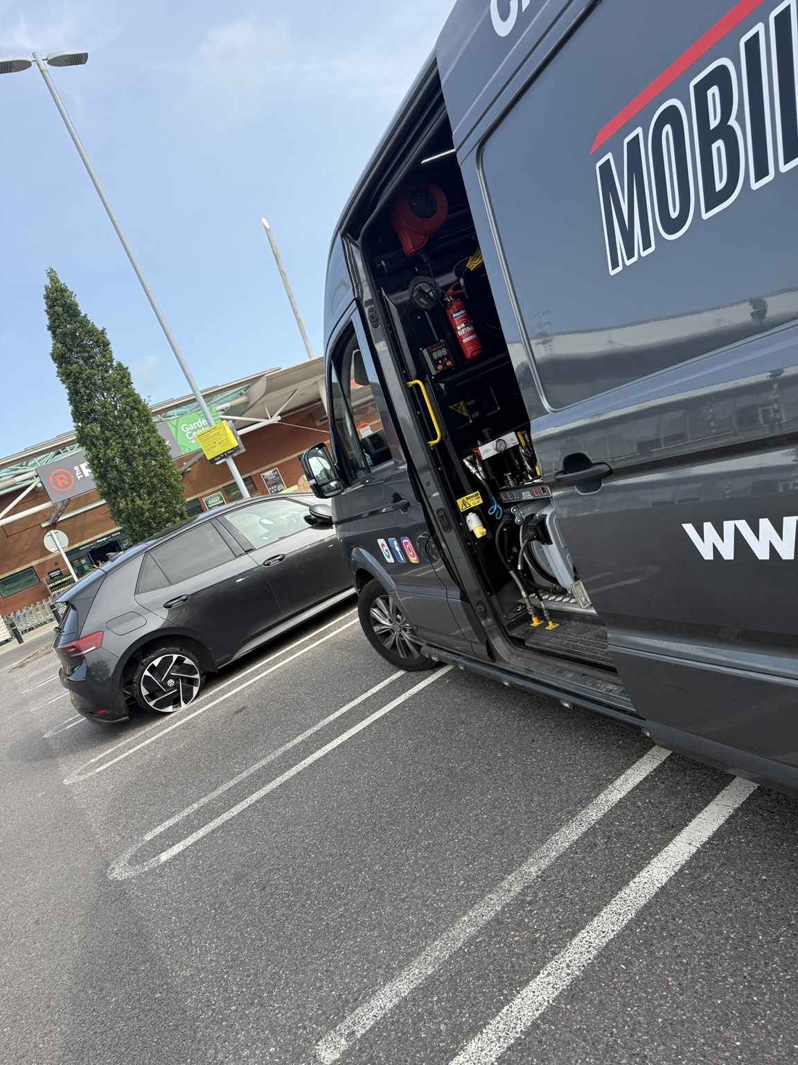Mobile tyre fitting equipment inside the branded van