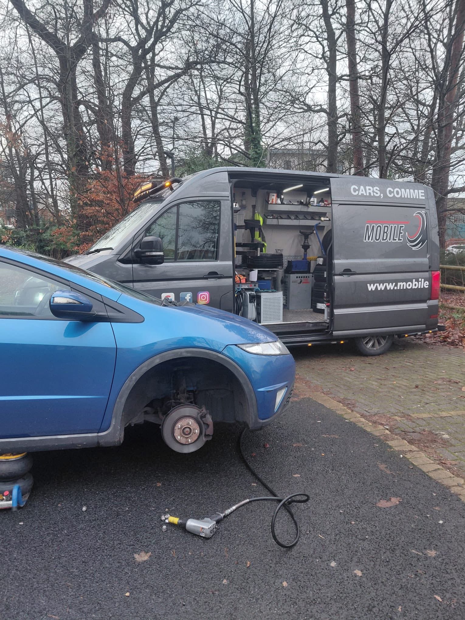 Mobile Tyre Tech van and a blue car during an on-site tyre fitting job